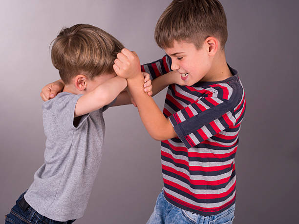 two-angry-brothers-fighting-eachother-picture-id185922048